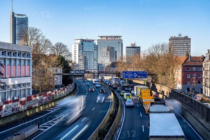 The A40 motorway, Ruhrschnellweg, in Essen, city skyline, Evonik office building, traffic jam in the westbound lane, Duisburg, slow traffic, North Rhine-Westphalia, Germany