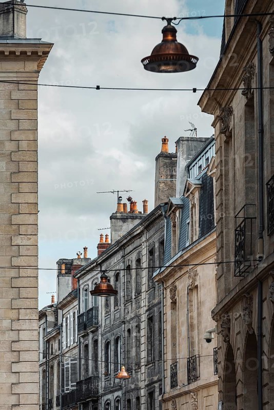 Old town alleyway with typical alleyway lights in Bordeaux, Gironde, France