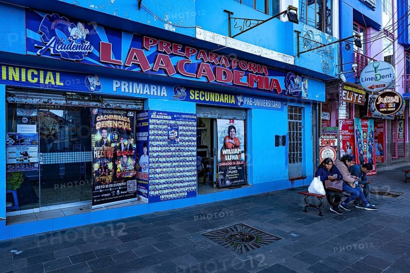 Street scene, blue house façade of an educational institution for various levels of education from preschool to pre-university, Puno, southern Peru, South America