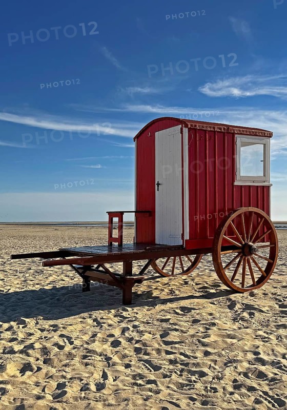 A red bathing cart on the west beach with the sea, North Sea island of Borzburg, East Frisia, Lower Saxony, Germany