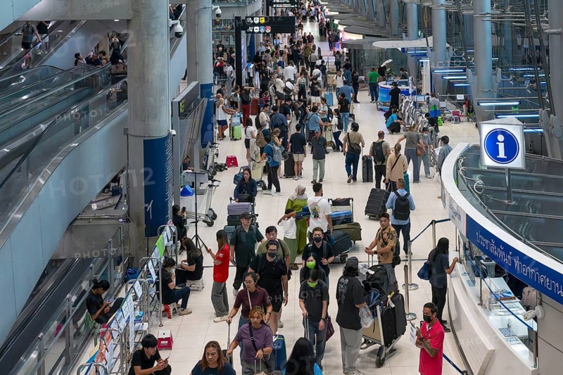 Suvarnabhumi airport tourists with luggage, Bangkok, Thailand