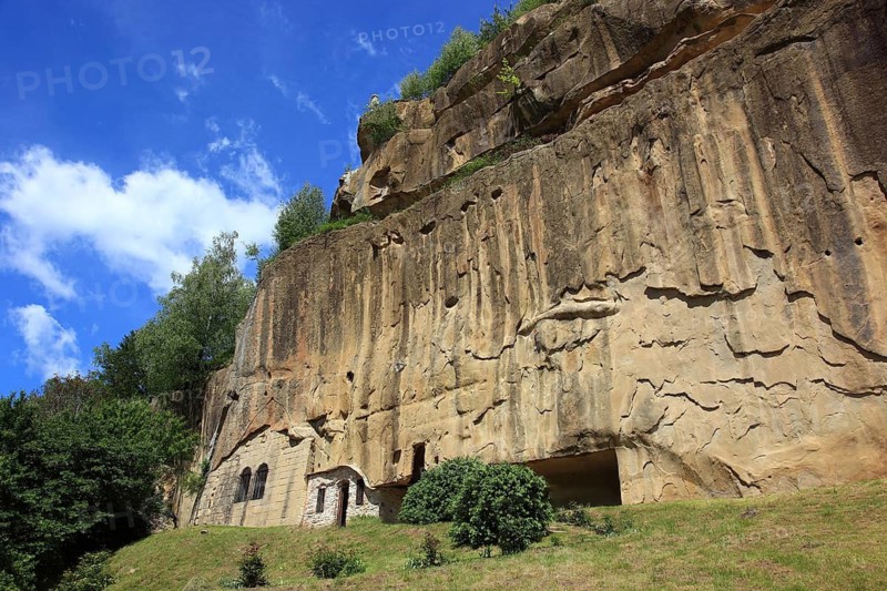 Corbii de Piatra rock monastery, stone ravens carved into a massive, 30-meter high sandstone wall, village of Jgheaburi, municipality of Corbi, in the district of Argesin, Wallachia, Romania