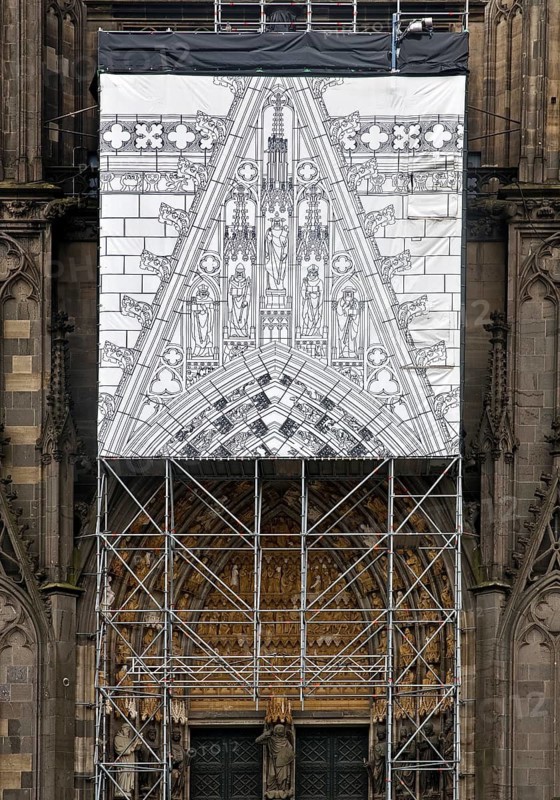 Scaffolding with black and white depiction of the restoration work on the north façade, Cologne, Rhineland, North Rhine-Westphalia, Germany