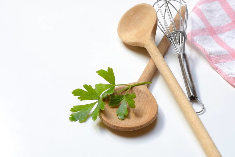 Cooking spoon and parsley, herb, Petroselinum crispum
