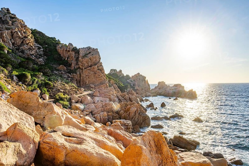 Landscape of the coastline with blue water at Costa Paradiso on a sunny day at evening, Sardinia, Italy