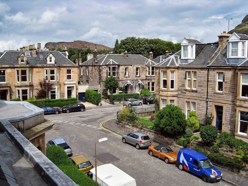 View from a window of traditional Scottish stone-look townhouses, historic residential street Marchhall Crescent, Newington, Edinburgh, Scotland, Great Britain