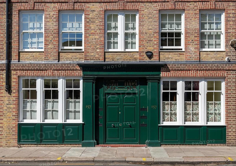 Brick building with large windows and a distinctive green entrance door, Royal Borough of Kensington and Chelsea, London, Great Britain, England, Great Britain