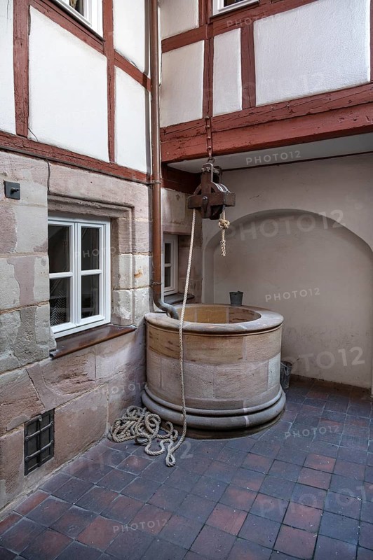 Old fountain in a historic courtyard, Obere Krämergasse 16, Nuremberg, Middle Franconia, Bavaria, Germany