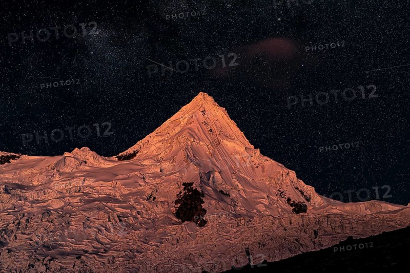 Alpamayo with alpamayo glacier against a starry sky, 5947 m, with the title of most beautiful mountain in the world, Cordillera Blanca, Huascaran National Park, northern Peru, Peru, South America