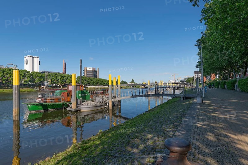 Excursion ship Weser at the pier, Weser promenade, Hanseatic city of Bremen, MS Weser, passenger ship, sightseeing, river trip, passenger ship, round trip, harbor tour, Weser promenade, battles, tourism, boat dock, deck, shipping, river landscape, leisure, excursion, tourist attraction, city view, waterway, maritime heritage, Beck's tower, dolphins, cloudless blue sky, fortified shore, city-state, Germany