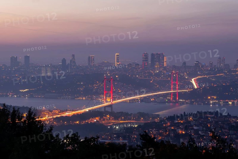 View from Camlica hill to 15 July Martyrs bridge with scyscrapers in the backgroun.d during the blue hour.Romantic Istanbul. Turkey