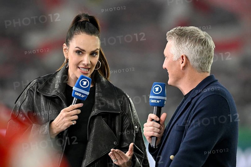 Bastian Schweinsteiger in interview, discussion with presenter reporter ARD Esther Sedlaczek, microphone, logo, smiles, soccer Bundesliga, DFB-Pokal, MHPArena, MHP Arena Stuttgart, Baden-Württemberg, Germany