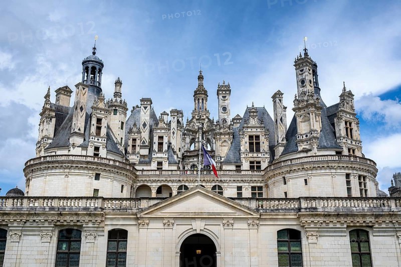 Southeast view, detailed view of the monumental Renaissance Château de Chambord castle with its distinctive, richly decorated roof silhouette of numerous towers, chimneys and dormers, Chambord Castle, Blois arrondissement, Loir-et-Cher department, Centre-Val de Loire region, France