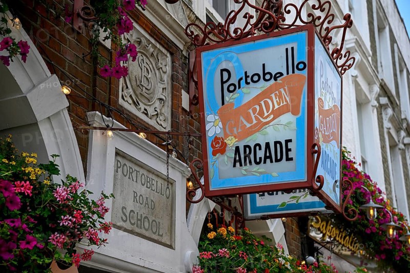 Detailed view of Portobello Garden Arcade entrance sign with floral decoration, Portobello Road, Notting Hill, Royal Borough of Kensington and Chelsea, London, England, Great Britain, Great Britain
