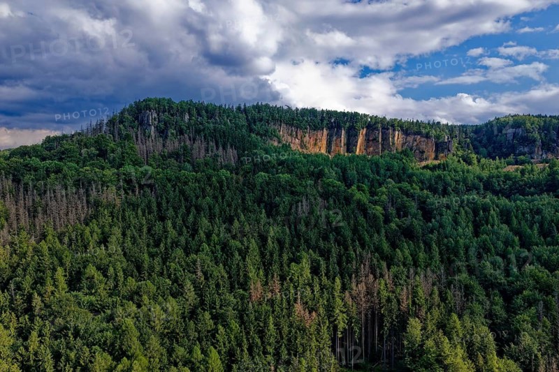 High rock formation in the Heuscheuergebirge National Park. The Heuscheuergebirge National Park, Park Narodowy Gopr Stolowych, is located in the Central Sudetes, Lower Silesia, in southwestern Poland. aerial view. Radkow, Szczytna, Silesia, Poland