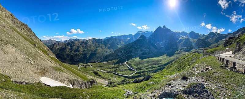Panoramic view panoramic photo with view of Italian south ramp southern driveway mountain road Alpine road to pass in Alps Alpine pass above tree line Colle di Gran San Bernardo, Col du Grand Saint Bernard Pass, Saint-Rhémy-en-Bosses, Italy