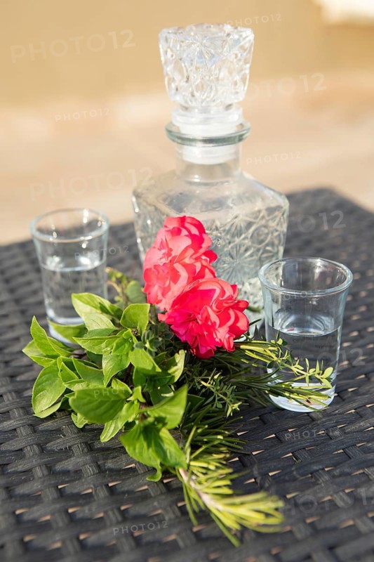Red hibiscus flower, Greek herbs and raki, Crete, Greece