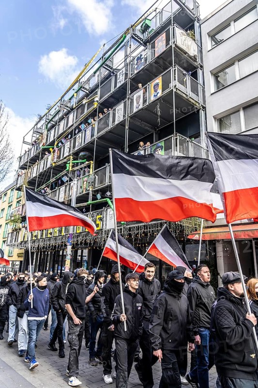 The neo-Nazi group Jung und Stark, JS, demonstrates in the city centre of Essen, demanding the remigration of foreigners, chanting Deutschland den Deutschen Ausländer raus, approx. 150 ultra right-wingers, dressed in black and wearing typical scene clothing, several groups demonstrate against the Nazi march, Essen, North Rhine-Westphalia, Germany