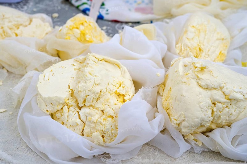 Fresh pieces of cheese wrapped in white cloths, presented in a rustic setting, Central Market, Piata Centrala, Chisinau, Chisinau, Chisinau, Chisinau, Chisinau, Republic of Moldova, Moldova, Eastern Europe