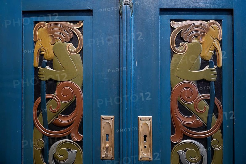 Blue-painted cabinet with incorporated relief depictions of trolls in Art Nouveau style, Museum Jugendstilsenteret og KUBE, Ålesund or Alesund, Møre og Romsdal Fylke, Norway