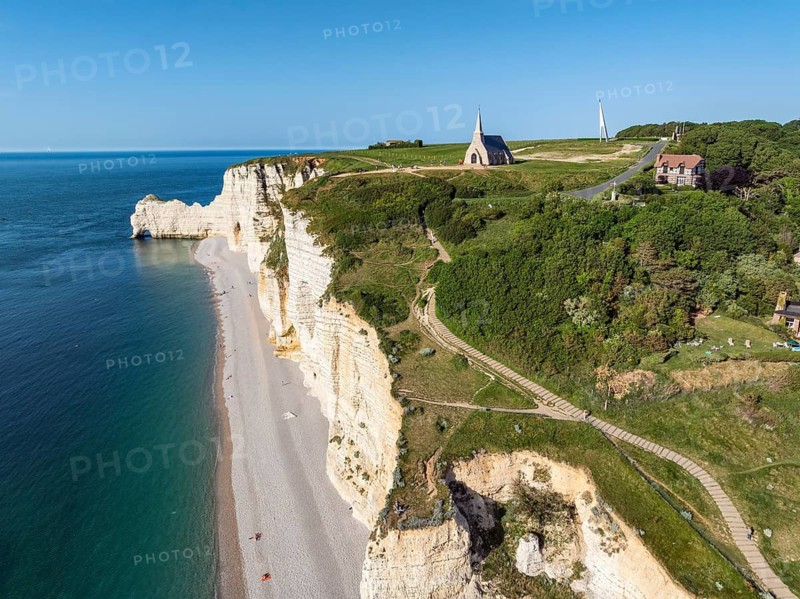 Aerial view of Falaise d'Amont cliffs, Porte d'Amont rock gate on the left, Notre Dame de la Garde chapel, Étretat, Alabaster Coast, La Côte d'Albâtre, chalk cliffs, English Channel, Seine-Maritime, Normandy, France