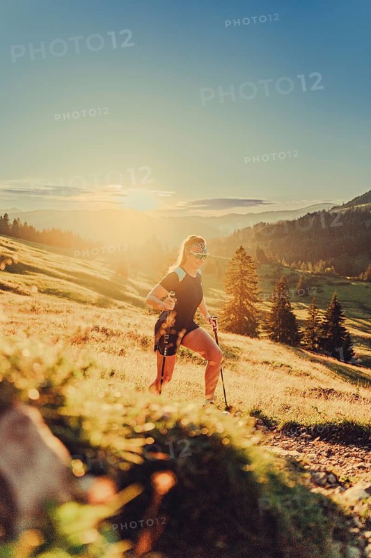 Summer trail running and hiking in the Alps on the Riedberg Pass between Obermaiselstein and Balderschwang in the Allgäu, Bavaria, Germany