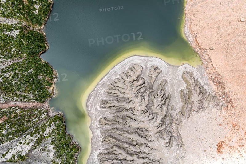 Lake with sandbank and dead trees, crater rim of chaiten volcano, aerial view, Patagonia, Chile