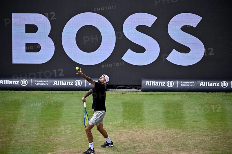 Nick Kyrgios (AUS) serving, with a Boss logo on the backboard in the background, BOSS Open 2026, ATP 250 tennis, grass-court tournament, Stuttgart, Baden-Württemberg, Germany