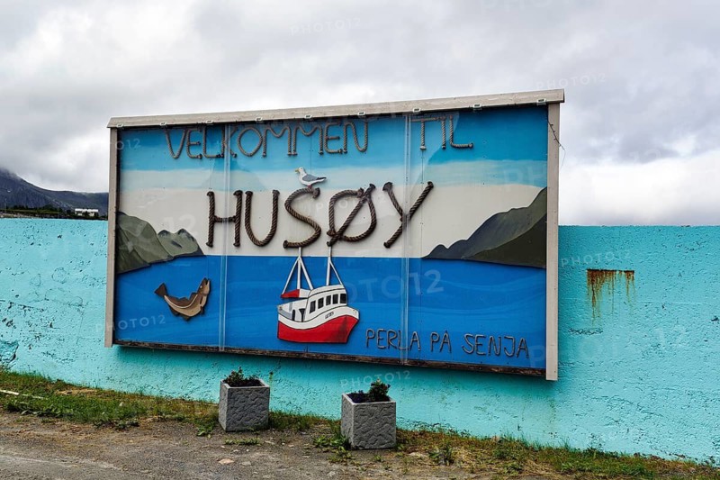 Sign with the words Welcome to Husoy Island, Husoy fishing village, island in Oyfjorden, Senja, Norway