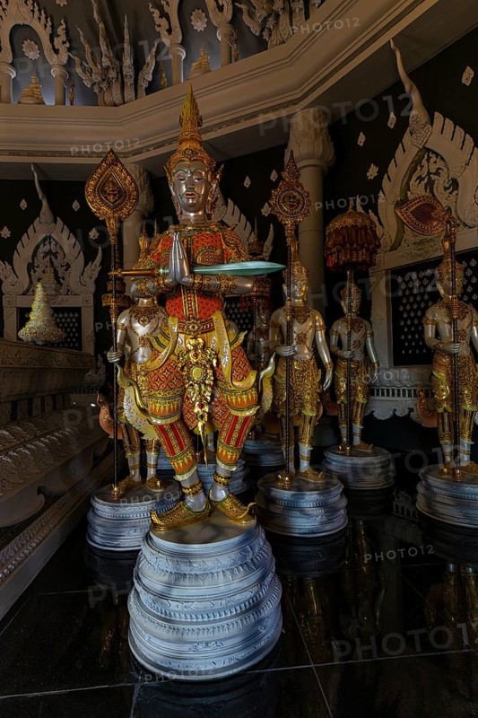 Figures as heavenly beings and temple guards in the public prayer hall in the Buddhist temple complex Wat Phra That Don Phra Chan, near Lampang, Lampang Province, Thailand