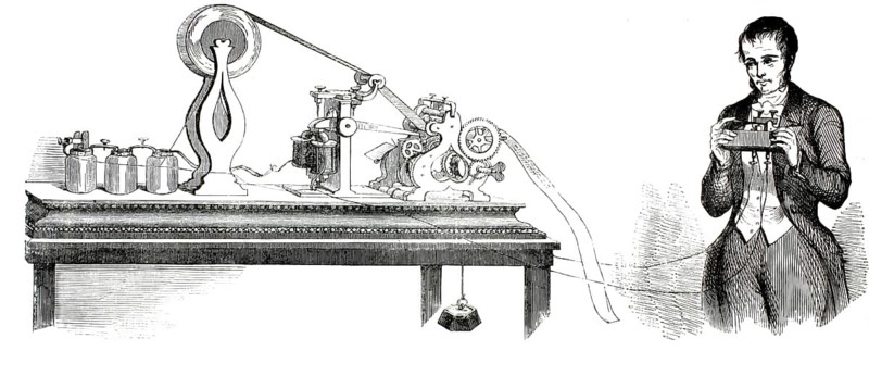 A 19th-century engraving depicts the American inventor Samuel Finley Breese Morse (1791–1872) standing next to his electromagnetic telegraph. The illustration shows the early Morse apparatus, consisting of the transmitting unit (telegraph key), batteries and the receiver, which records the signals on a strip of paper, 1837, authentic, high-resolution reproduction of a 19th-century original, exact date of the illustration unknown, historical