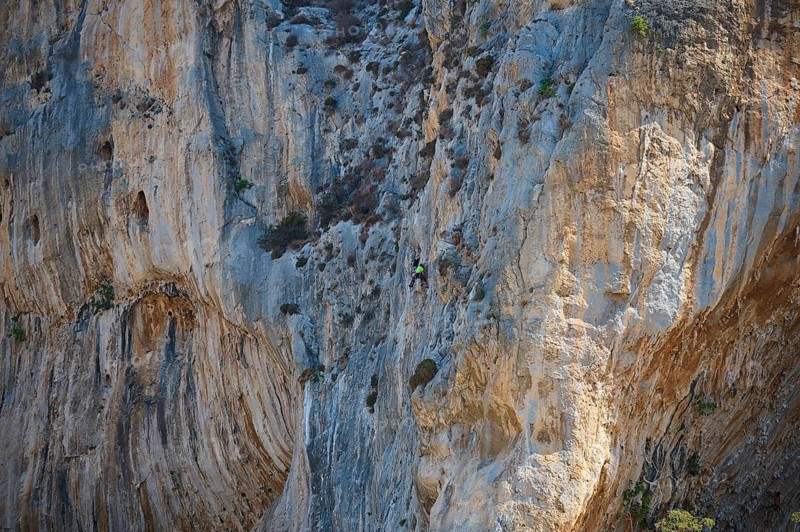 Massouri, Grande Grotta, climbing, climber climbing a steep, rough rock face in natural surroundings, Kalymnos, Sponge Diving Island, Dodecanese, Greek Islands, Greece
