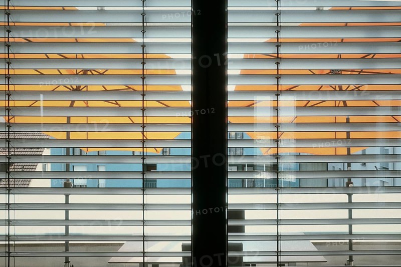 View from an interior, living area through two window wings with external blinds, external blinds and two stretched parasols on a balcony, symbol of heat protection, heat wave, midsummer, summer break, Baden-Württemberg, Germany