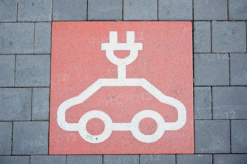 Paving stones and symbol for charging station for electric cars, Bergkamen, North Rhine-Westphalia, Germany