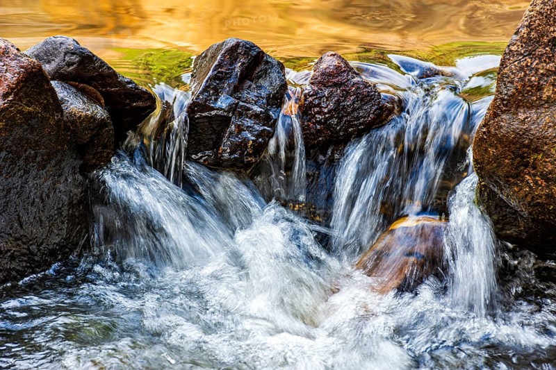 Water flowing between rocks in a small stream, Minas Gerais, Brazil