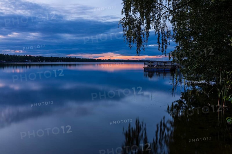 Quiet evening mood at the lake at sunset on Lake Hinden near Värnamo, Jönköpings län, Sweden