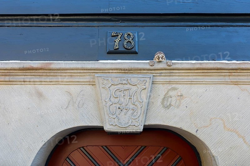 Coat of arms with initials and the year 1777 made of sandstone on a door frame of a half-timbered house in Waltersdorf, Großschönau, Saxony, Germany