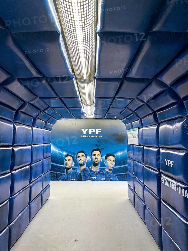 Buenos Aires subway pedestrian tunnel simulates a player tunnel with Argentinean national players Lionel Messi, Enzo Fernández, Rodrigo de Paul and Leandro Paredes as an advertisement for the energy company YPF, Buenos Aires, Argentina