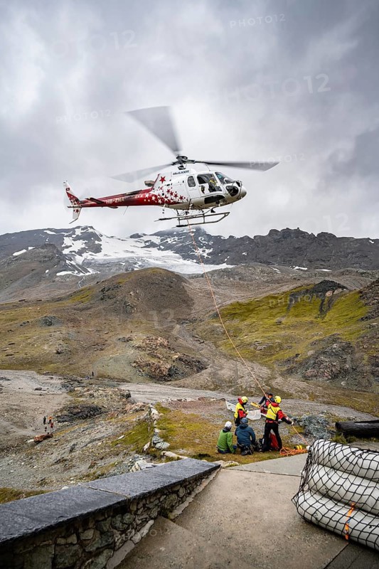 Air rescue operations in the mountains, rescue helicopter, Valais, Switzerland