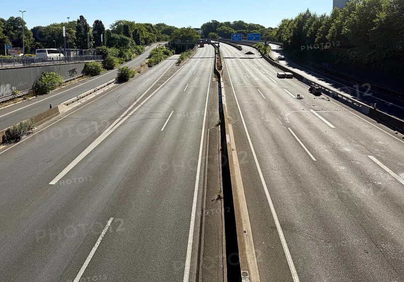 Empty A 40 motorway in the center in front of entering the tunnel, closure, construction work during holidays in midsummer, Essen, Ruhr area, Germany