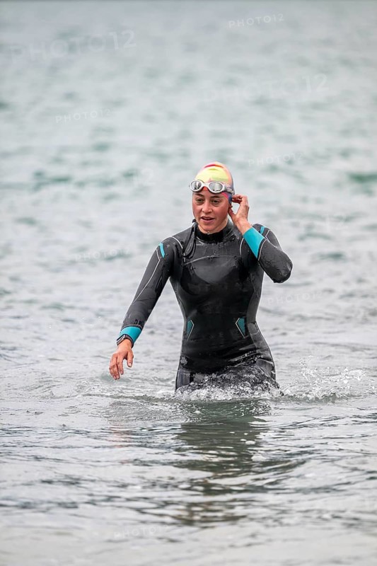 Sportswoman, swimmer comes out of the water after the swimming stage, Tegernsee Triathlon, Tegernsee, Upper Bavaria, Bavaria, Germany
