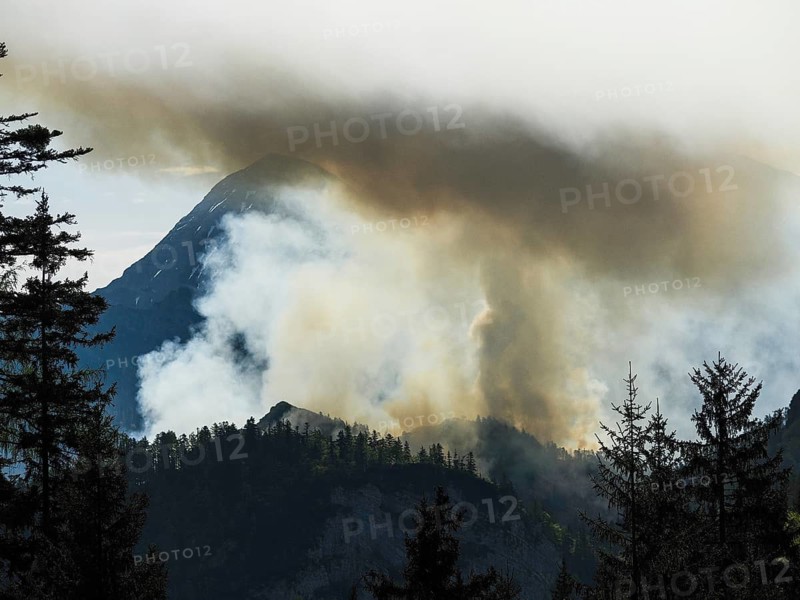 Forest fire on Saurüsselkopf in the Eastern Chiemgau Alps nature reserve on May 4, 2026, the Sonntagshorn in the background, Laubau, Bavaria, Germany