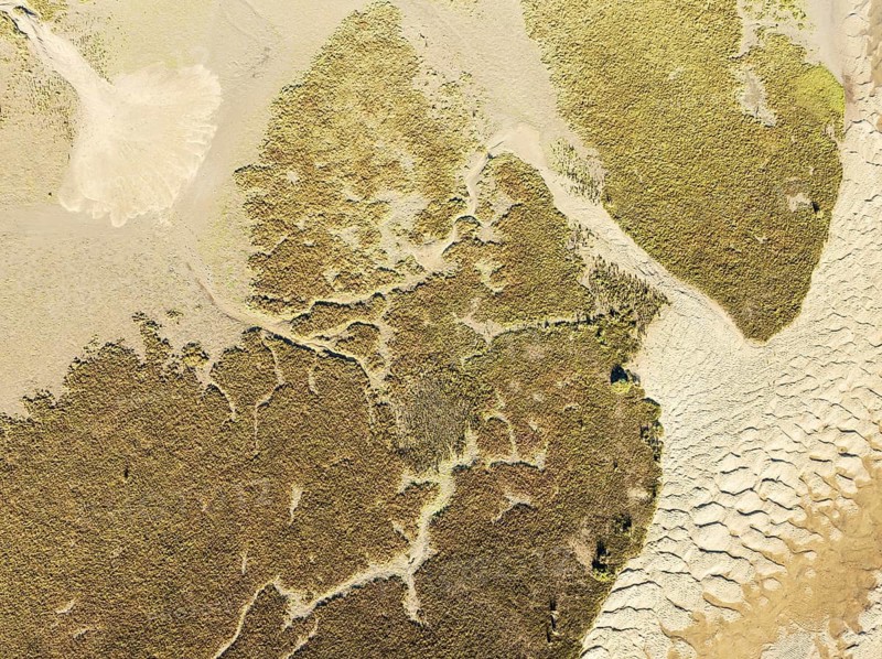 Sandy drifts at low tide at the Lago de la Gaviota (lake of the seagull). Aerial view. Drone shot. Isla Cristina, Huelva province, Andalusia, Spain