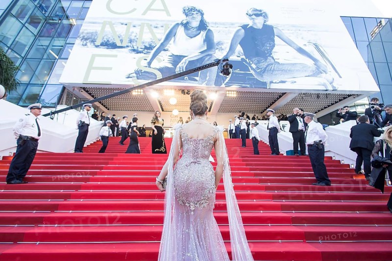 Woman in a long glittering dress walks up the stairs at the opening gala and premiere of La Vénus Électrique (The Electric Kiss) on the red carpet of the Palais des Festivals et des Congrès during the 79th Cannes International Film Festival. The 79th Cannes International Film Festival will take place from 12 to 23 May 2026