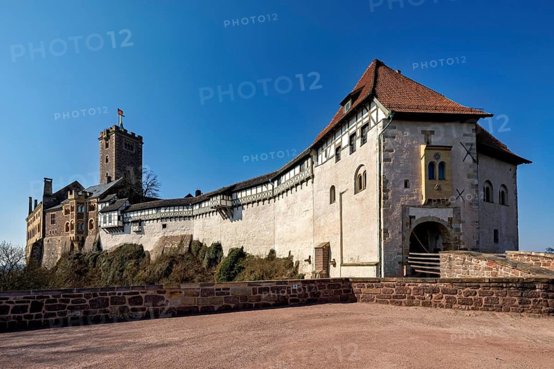 Castle with half-timbered buildings and red tiled roof against a clear sky, The Wartburg near Eisenach in Thuringia