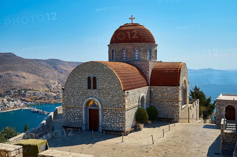Agiou Sarvas monastery, Agion Pandon church, simple stone church with dome, with sea and mountain views in the background, Pothia, main town, port, Kalymnos, Sponge Diving Island, Dodecanese, Greek Islands, Greece