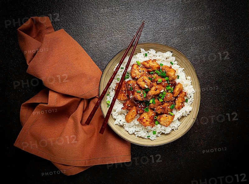 Fried chicken teriyaki with rice, green onion and sesame, homemade, no people