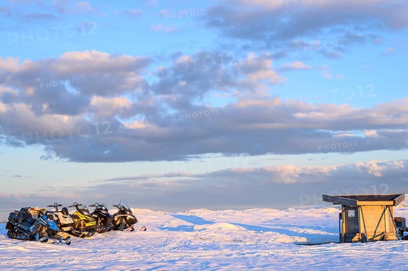 Ljungdalen, Jämtlands län, Sweden, snowy landscape with snowmobiles and a small hut under a blue sky with clouds, Flatruet, Berg, Härjedalen Län, Sweden