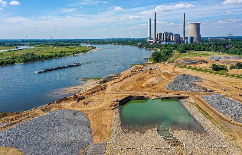 Dinslaken, Voerde, North Rhine-Westphalia, Germany, Emscher estuary into the Rhine. Construction site of the new Emscher estuary in front of the decommissioned STEAG coal-fired power station in Voerde. The mouth of the Emscher into the Rhine is being moved almost 500 metres north from Dinslaken to Voerde. Fish will then be able to swim barrier-free up the new Emscher from the Rhine through a newly created floodplain area. Following the construction of a parallel sewer, the Emscher has been completely free of sewage since January 2022. The river was previously an open, above-ground combined sewer with rainwater and wastewater