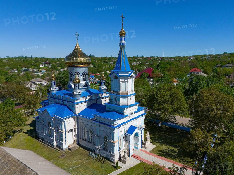 Orthodox church with blue and gold dome under clear sky, aerial view, Biserica de iarna, iarna, Tareuka, Tareuca, Rezina district, Republic of Moldova, Moldova